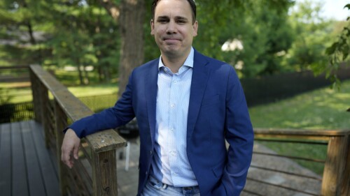 KCCI-TV chief meteorologist Chris Gloninger stands outside his home, Tuesday, June 27, 2023, in West Des Moines, Iowa. Gloninger has announced that he is leaving the Des Moines station due in part to threats he received for his coverage of climate change on air. (AP Photo/Charlie Neibergall)