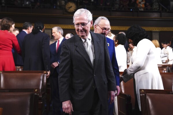 Senate Minority Leader Mitch McConnell of Ky., center, followed by Senate Majority Leader Chuck Schumer, D-N.Y., arrive before President Joe Biden delivers the State of the Union address to a joint session of Congress at the Capitol, Thursday, March 7, 2024, in Washington. (Shawn Thew/Pool via AP)