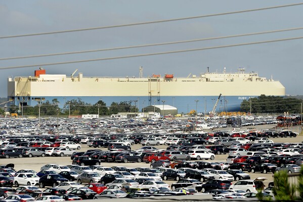 FILE - In this Oct. 20, 2015 file photo, new automobiles being shipped through the Port of Brunswick sit in a vast parking lot at the Colonel's Island terminal in Brunswick, Ga. The Georgia Ports Authority says it handled a record number of automobiles on its docks last year. The state agency reported Tuesday, Jan. 30, 2024 that more than 775,000 autos and heavy machinery units moved through the Port of Brunswick in the 2023 calendar year. (Bobby Haven/The Brunswick News via AP, file)