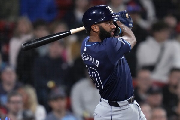 Tampa Bay Rays' Amed Rosario watches the flight of his RBI double during the eighth inning of a baseball game against the Boston Red Sox, Monday, May 13, 2024, in Boston. (AP Photo/Charles Krupa)
