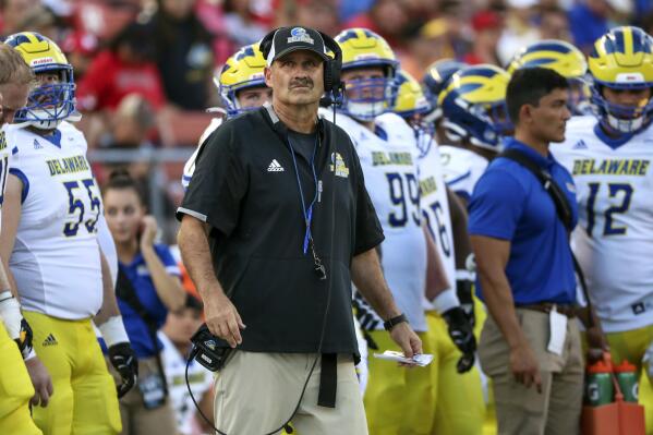 FILE - Delaware head coach Danny Rocco, center, watches from the sideline during the second half of an NCAA college football game against Rutgers, on Sept. 18, 2021, in Piscataway, N.J. Virginia Military Institute has hired Rocco as its football coach, the school announced Saturday, Dec. 3, 2022. (Andrew Mills/NJ Advance Media via AP, File)