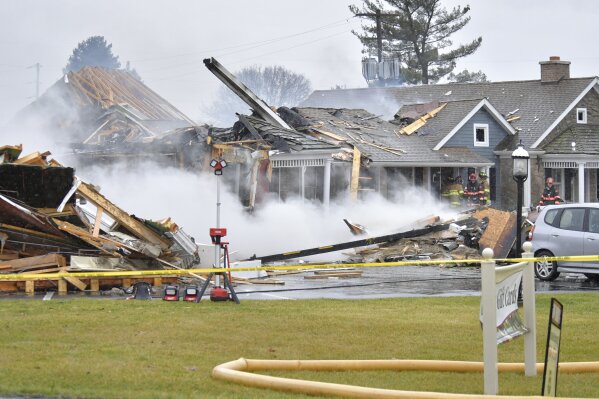 Work crews tear down part of the Bird-in-Hand Family Inn after an early morning fire on Monday, Dec. 18, 2023 in Bird-in-Hand, Pa. (Suzette Wenger/LNP/LancasterOnline via AP)
