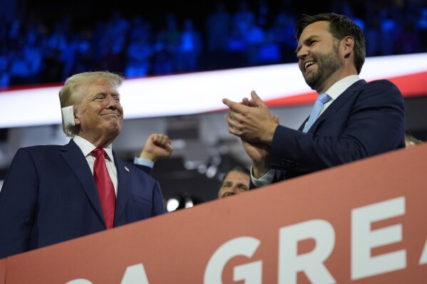 Republican presidential candidate former President Donald Trump and Republican vice presidential candidate Sen. JD Vance, R-Ohio, attend the first day of the Republican National Convention, Monday, July 15, 2024, in Milwaukee. (AP Photo/Evan Vucci)