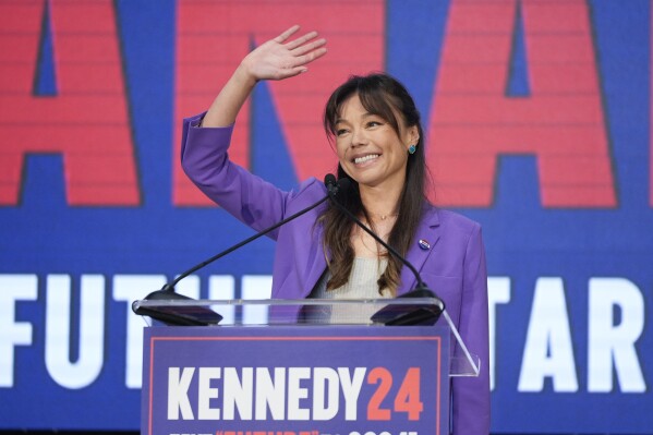 Nicole Shanahan waves from the podium during a campaign event for Presidential candidate Robert F. Kennedy Jr., Tuesday, March 26, 2024, in Oakland, Calif. Shanahan has been picked as Kennedy Jr.'s running mate. (AP Photo/Eric Risberg)
