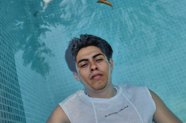 Murato Teatro cast member Aldo Martin Cortez snaps photos during a rehearsal break on May 17, 2025 in Tikuman, Mexico.