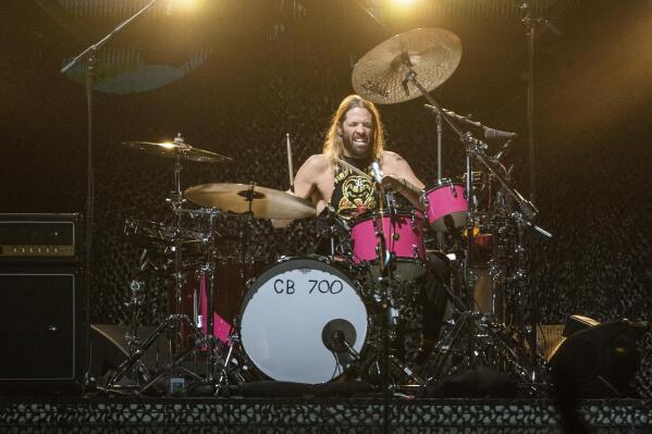 FILE - Taylor Hawkins of the Foo Fighters performs at the Innings Festival at Tempe Beach Park on Saturday, Feb, 26 2022, in Tempe, Ariz. Hawkins, the longtime drummer for the rock band Foo Fighters, has died, according to reports, Friday, March 25, 2022. He was 50. (Photo by Amy Harris/Invision/AP, File)