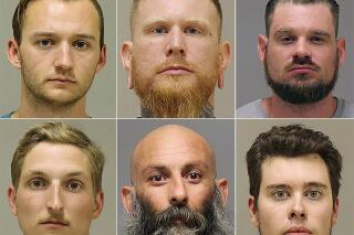 FILE - This photo combo shows from top left, Kaleb Franks, Brandon Caserta, Adam Dean Fox, and bottom left, Daniel Harris, Barry Croft, and Ty Garbin.   Defense attorneys have sought to dismiss the indictment against five men accused of plotting to kidnap Gov. Gretchen Whitmer because of what they describe as “egregious overreaching” by federal agents and informants. The Detroit News reports that defense attorneys filed a 20-page motion on Saturday, Dec. 25, 2021. (Kent County Sheriff via AP File)