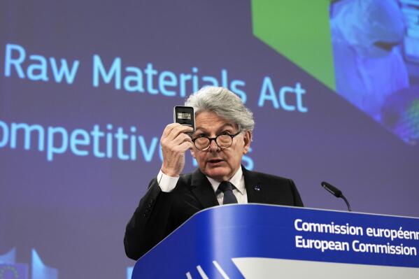 European Commissioner for Internal Market Thierry Breton holds up raw materials during a media conference after the weekly College of Commissioners meeting at EU headquarters in Brussels, Thursday, March 16, 2023. The College on Thursday discussed the Critical Raw Materials Act, the EU's long-term competitiveness strategy, and 30 years of the Single Market. (AP Photo/Virginia Mayo)