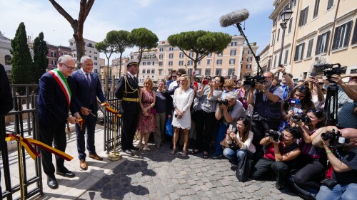 Rome's Mayor Roberto Gualtieri, left, and Bulgari CEO Jean-Christophe Babin cut the ribbon to inaugurate the walkways and nighttime illumination of the so called 'Sacred Area' where four temples, dating back as far as the 3rd century B.C., stand smack in the middle of one of modern Rome's busiest crossroads, Monday, June 19, 2023, With the help of funding from Bulgari, the luxury jeweler, the grouping of temples can now be visited by the public that for decades had to gaze down from the bustling sidewalks rimming Largo Argentina (Argentina Square) to admire the temples below where Julius Caesar masterminded his political strategies and was later fatally stabbed in 44 B.C. (AP Photo/Domenico Stinellis)