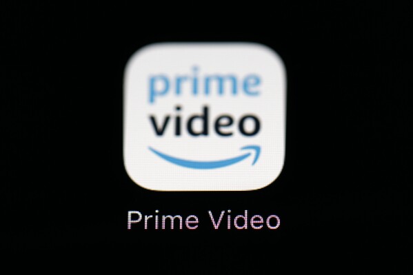 FILE - Amazon's Prime Video streaming app on an iPad is seen in Baltimore on March 19, 2018. Amazon says that it will now start charging $2.99 per month in order for users in the U.S. to watch Prime Video ad free. (AP Photo/Patrick Semansky, File)