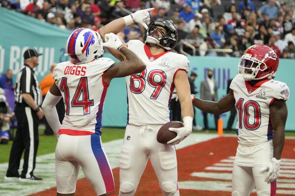 AFC tackle Mark Andrews (89), of the Baltimore Ravens, reacts with wide receiver Stefon Diggs (14), of the Buffalo Bills, and wide receiver Tyreek Hill (10), of the Kansas City Chiefs, after Andrews scored a touchdown in the first half of the Pro Bowl NFL football game against the NFC, Sunday, Feb. 6, 2022, in Las Vegas. (AP Photo/Rick Scuteri)
