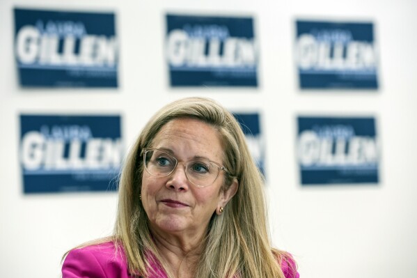 Laura Gillen, Democratic candidate for New York's 4th Congressional District, listens during a roundtable discussion outlining her policy platform to lower healthcare costs for Latino families, Thursday, Oct. 24, 2024, in Freeport, N.Y. (AP Photo/Heather Khalifa)