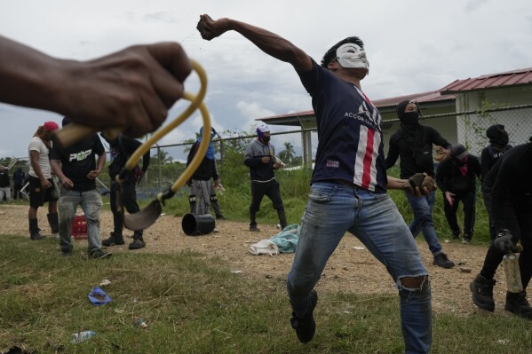 Anti-government protesters clash with police in the Indigenous Embera community in Alimae, Panama on Thursday, June 5th, 2025 (AP Photo/Matias Delacroix)