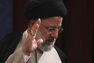 In this June 21, 2021, photo, Iran's new President-elect Ebrahim Raisi waves at the conclusion of his news conference in Tehran, Iran. Biden administration officials are insisting that the election of a hard-liner as Iran’s president won’t affect prospects for reviving the faltering 2015 nuclear deal with Tehran. But there are already signs that their goal of locking in a deal just got harder. (AP Photo/Vahid Salemi)