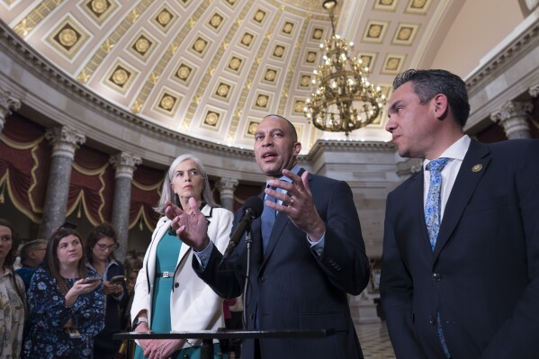 House Minority Leader Hakeem Jeffries, D-N.Y., center, flanked by Rep. Katherine Clark, D-Mass., the Democratic whip, left, and Rep. Pete Aguilar, D-Calif., the Democratic Caucus chair, speaks to reporters about the need for aid to allies Ukraine, Israel and Taiwan following weeks of inaction, at the Capitol in Washington, Wednesday, April 17, 2024. (AP Photo/J. Scott Applewhite)