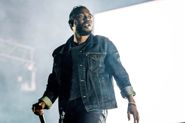 
              FILE - In this July 7, 2017, file photo, Kendrick Lamar performs during the Festival d'ete de Quebec in Quebec City, Canada. A list of nominees in the top categories at the 2019 Grammys, including Lamar, who is the leader with eight nominations, were announced Friday, Dec. 7, 2018, by the Recording Academy. Drake, Cardi B, Brandi Carlile, Childish Gambino, H.E.R., Lady Gaga, Maren Morris, SZA, Kacey Musgraves and Greta Van Fleet also scored multiple nominations. (Photo by Amy Harris/Invision/AP, File)
            