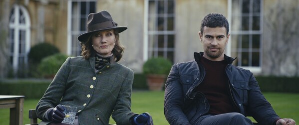 This image released by Netflix shows Joely Richardson, left, and Theo James from the Netflix series "The Gentlemen." (Christopher Rafael/Netflix via AP)