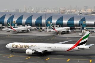 FILE - An Emirates plane taxis to a gate at Dubai International Airport at Dubai International Airport in Dubai, United Arab Emirates, on Wednesday, March 22, 2017. Long-haul carrier Emirates said Thursday, May 11, 2023, it saw its most-profitable year ever in 2022, earning $2.9 billion after bouncing back from the coronavirus pandemic shutting down global aviation. (AP Photo/Adam Schreck, File)
