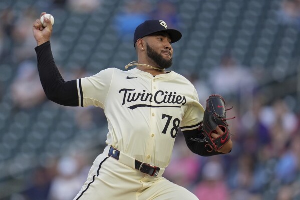 Minnesota Twins starting pitcher Simeon Woods Richardson delivers during the fourth inning of a baseball game against the Seattle Mariners, Monday, May 6, 2024, in Minneapolis. (AP Photo/Abbie Parr)