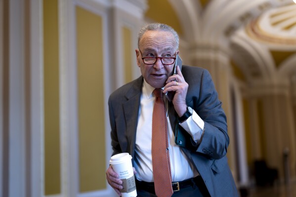 Senate Majority Leader Chuck Schumer, D-N.Y., arrives at the Capitol while Republicans hold a closed-door meeting after blocking a bipartisan border package that had been tied to wartime aid for Ukraine, at the Capitol in Washington, Thursday, Feb. 8, 2024. (AP Photo/J. Scott Applewhite)