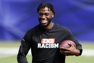 FILE - In this Sept. 13, 2020, file photo, Baltimore Ravens quarterback Robert Griffin III (3) stands on the field before an NFL football game against the Cleveland Browns in Baltimore. The former Heisman Trophy winner and Pro Bowl quarterback has signed a multi-year deal with ESPN to be a college football and NFL analyst. The deal also allows Griffin III to seek a playing opportunity with a team if one arises. (AP Photo/Nick Wass, File)