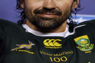 FILE-In this photo taken Saturday, Aug. 28, 2010 South Africa's Victor Matfield is honored for his 100 Tests match in Pretoria, South Africa. The Bulls Super Rugby team announced Matfield's playing return on Friday, Jan. 31, 2014, saying it offered him a contract for the 2014 and 2015 seasons, which "he has gladly accepted." Matfield will also attempt to represent the Springboks again having played 110 tests for his country before retiring after the 2011 World Cup. (AP Photo/Themba Hadebe)