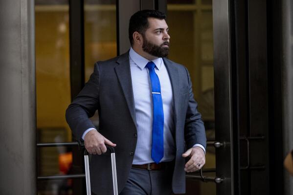 Roberto Minuta of Prosper, Texas, leaves federal court in Washington, Monday, Jan. 23, 2023, after he and three other members of the Oath Keepers have been convicted of seditious conspiracy in the Jan. 6, 2021 Capitol attack in the second major trial involving far-right extremists accused of plotting to forcibly keep President Donald Trump in power. (AP Photo/Andrew Harnik)