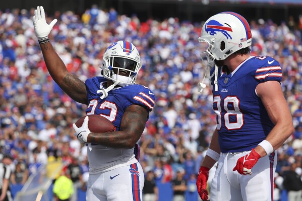 Buffalo Bills' Damien Harris (22) celebrates with teammate Dawson Knox (88) after rushing for a touchdown during the second half of an NFL football game against the Las Vegas Raiders, Sunday, Sept. 17, 2023, in Orchard Park, N.Y. (AP Photo/Jeffrey T. Barnes)