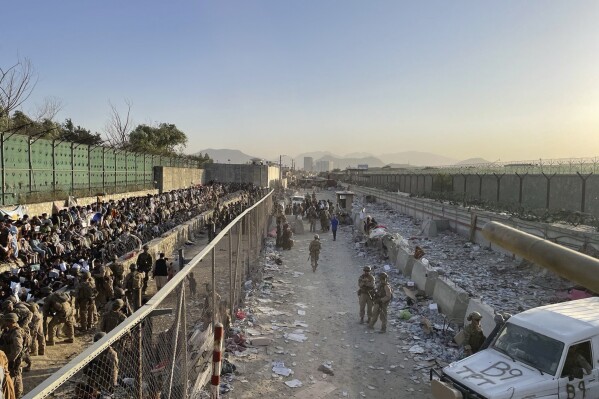 The bombing area at Abbey Gate is pictured August 26, 2021, in Kabul, Afghanistan, before the blast. A review released Monday, April 15, 2024, says the suicide bombing at the Kabul airport that killed U.S. troops and Afghans in August 2021 was not preventable, and the “bald man in black” spotted by U.S. service members the morning of the attack was not the bomber. (U.S. Central Command via AP)