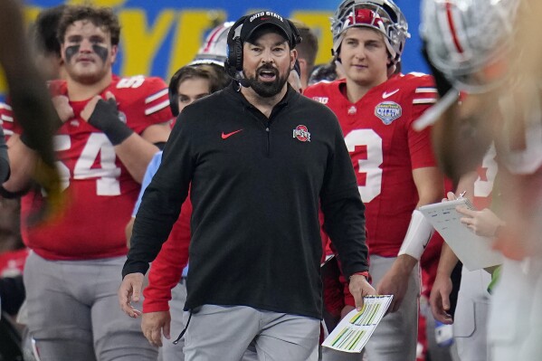 Ohio State head coach Ryan Day, center, reacts on the sideline during the second half of the Cotton Bowl NCAA college football game against Missouri, Friday, Dec. 29, 2023, in Arlington, Texas. (AP Photo/Julio Cortez)