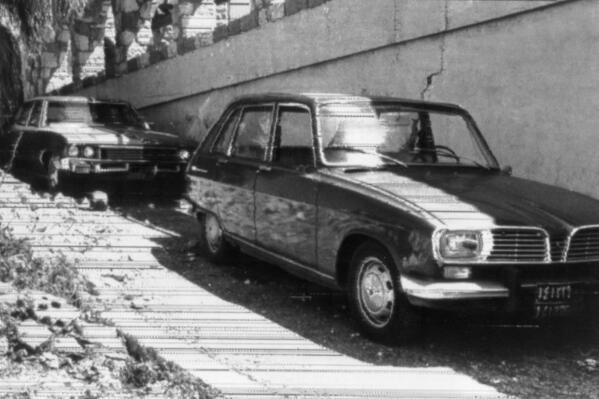 FILE - These two cars found just outside Beirut, Lebanon, are believed to be those used by the Israeli troops in raids on Palestinian leaders on April 10, 1973. The Israeli commando force led by a man disguised as brunette. Ehud Barak, who later rose to become Israel's prime minister, infiltrated a posh Beirut neighborhood shooting dead three top officials with the Palestine Liberation Organization in two separate adjacent buildings. (AP Photo/Zaven Vartan, File)