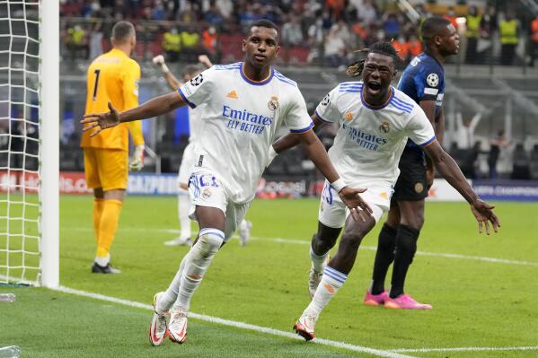 Real Madrid's Rodrygo, left, celebrates with Real Madrid's Eduardo Camavinga after scoring his sides first goal during the Champions League group D soccer match between Inter Milan and Real Madrid at the San Siro stadium in Milan, Italy, Wednesday, Sept. 15, 2021. (AP Photo/Antonio Calanni)
