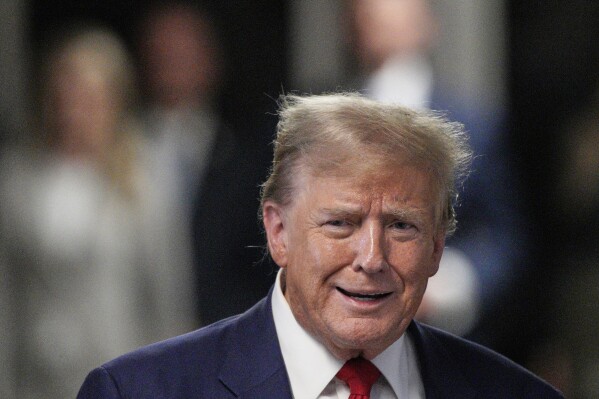 Former President Donald Trump speaks to the media outside the courtroom of his trial at Manhattan Criminal Court on Tuesday, April 30, 2024 in New York.  (Words by Curtis/Pool photo via AP)