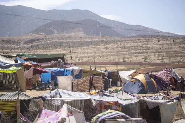Tents are set up to shelter people who were displaced by the earthquake, in the town of Amizmiz, near Marrakech, Morocco, Sunday, Sept. 10, 2023. (AP Photo/Mosa'ab Elshamy)