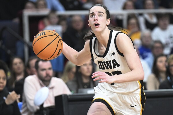 Iowa guard Caitlin Clark (22) drives to the basket against the LSU during the second half of an Elite Eight round college basketball game during the NCAA Tournament, Monday, April 1, 2024, in Albany, N.Y. (AP Photo/Hans Pennink)