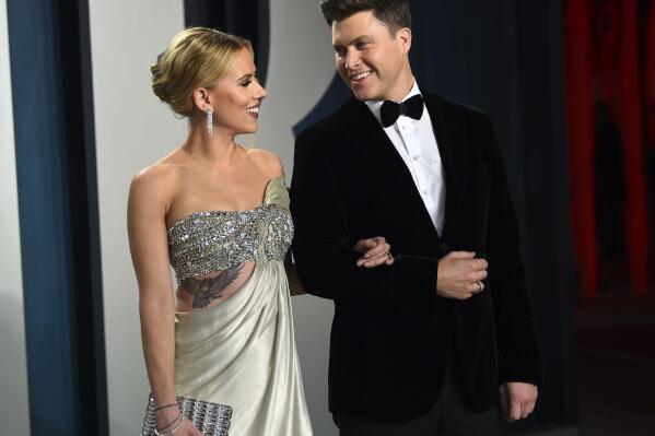 FILE - In this Feb. 9, 2020 file photo, Scarlett Johansson, left, and Colin Jost arrive at the Vanity Fair Oscar Party in Beverly Hills, Calif. Johansson is a mom to two now. The “Black Widow” star recently gave birth to a son, Cosmo, with husband Colin Jost, the “Saturday Night Live” star said on Instagram Wednesday, Aug. 18, 2021. This is the first child for the couple, who were married last October. (Photo by Evan Agostini/Invision/AP, File)