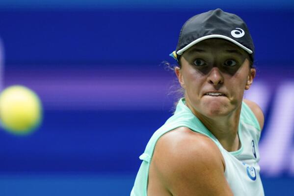 Iga Swiatek, of Poland, returns a shot to Aryna Sabalenka, of Belarus, during the semifinals of the U.S. Open tennis championships, Thursday, Sept. 8, 2022, in New York. (AP Photo/Frank Franklin II)