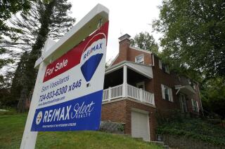 FILE - A for sale sign is displayed outside a home in Mount Lebanon, Pa., on Tuesday, Sept. 21, 2021.  Long-term U.S. mortgage rates continued to climb this week, Thursday, April 14, 2022,  as the key 30-year loan rate reached 5% for the first time in more than a decade amid persistent high inflation. The average 5% rate on the 30-year mortgage was up from 4.72% last week, mortgage buyer Freddie Mac reports.   (AP Photo/Gene J. Puskar)