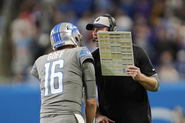 Detroit Lions head coach Dan Campbell gives quarterback Jared Goff the last play of the game during the second half of an NFL football game against the Minnesota Vikings, Sunday, Dec. 5, 2021, in Detroit. (AP Photo/Paul Sancya)