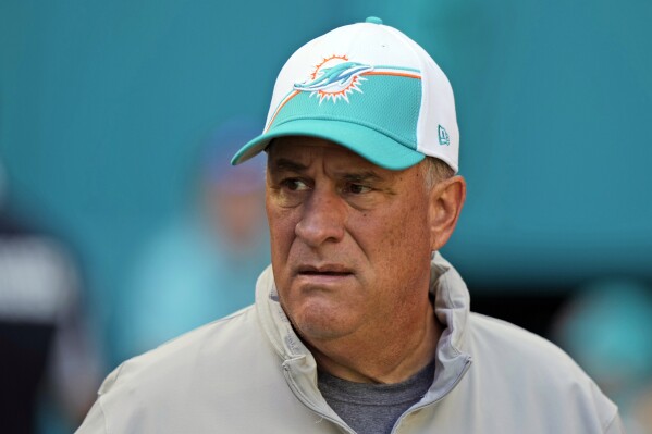FILE - Miami Dolphins defensive coordinator Vic Fangio heads onto the field before the start of an NFL football game against the Carolina Panthers, Sunday, Oct. 15, 2023, in Miami Gardens, Fla. The Philadelphia Eagles have hired Vic Fangio to be their defensive coordinator, the team announced Saturday, Jan. 27, 2024. (AP Photo/Wilfredo Lee, File)