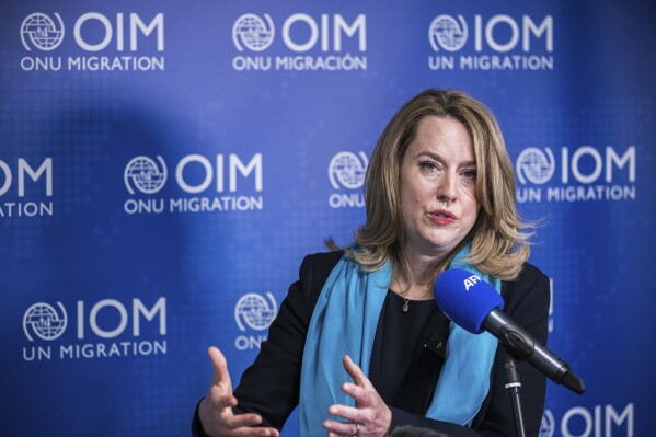 FILE - Newly elected 'International Organization for Migration' (OIM) director general Amy Pope, from the U.S. speaks during a press conference in Geneva, Switzerland, Monday, May 15, 2023. The U.N.'s migration agency is launching its first “global appeal” that seeks $7.9 billion to help people on the move and ensure smoother pathways to migration at a time when the fallout from climate change, conflict and both economic and political distress and opportunity has caused millions to leave their homes. (Pierre Albouy/Keystone via AP, file)