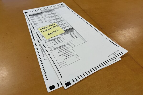 The new two-page ballot that Arizona voters will have to fill out this year is seen here, Tuesday, Sept. 10, 2024, in Phoenix. (AP Photo/Gabriel Sandoval)