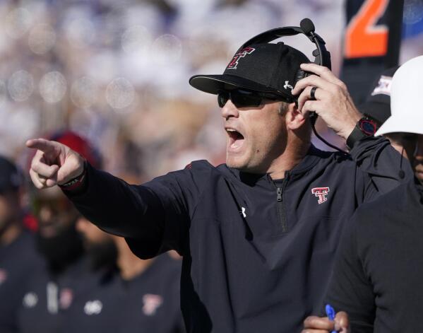 Texas Tech head coach Matt Wells yells instructions to his team against the Kansas during the second quarter of an NCAA college football game Saturday, Oct. 16, 2021, in Lawrence, Kan. (AP Photo/Ed Zurga)
