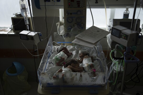 Premature babies are prepared for transport to Egypt after they were evacuated from Shifa Hospital in Gaza City to a hospital in Rafah, Gaza Strip, Monday, Nov. 20, 2023. (AP Photo/Fatima Shbair)