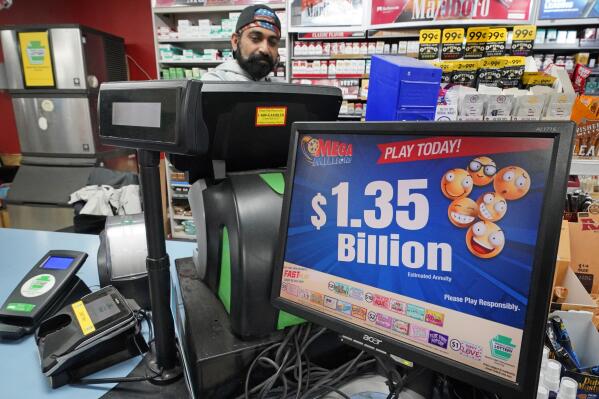 FILE - A Mega Million sign displays the estimated jackpot of $1.35 Billion at the Cranberry Super Mini Mart in Cranberry, Pa., Jan. 12, 2023. The winner of a $1.35 billion Mega Millions jackpot has come forward to collect the prize. The Maine State Lottery announced Wednesday, Feb. 22, that the winner chose to remain anonymous and collect the cash option through a limited liability company instead of receiving the full amount in payments over time. (AP Photo/Gene J. Puskar, File)