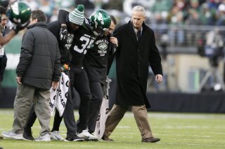 FILE - In this Dec. 8, 2019, file photo, New York Jets cornerback Kyron Brown (35) is helped off the field after being injured during the second half of an NFL football game against the Miami Dolphins in East Rutherford, N.J. The New York Jets finished the season with a league-high 20 players on injured reserve and had so many other injuries the organization is studying every step from practice to recovery down to how they care for injuries to stay healthier in the future. Jets general manager Joe Douglas hopes 2019 was a “bit of anomaly.” (AP Photo/Adam Hunger, File)