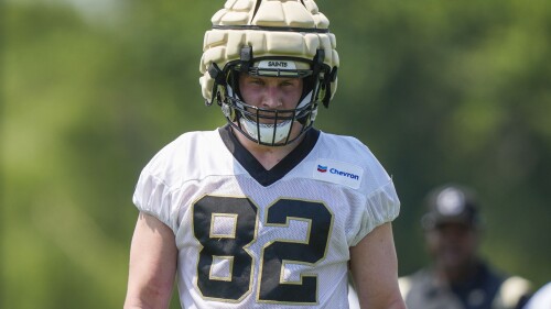 FILE - New Orleans Saints tight end Foster Moreau walks between drills during NFL football practice in Metairie, La., May 23, 2023. Moreau says he is in “full remission” from cancer that team doctors discovered in late March. The 26-year-old Moreau says in a social media post that his “prayers were answered” and that he's “so grateful to everyone who reached out to offer their love and support." (AP Photo/Gerald Herbert, File)