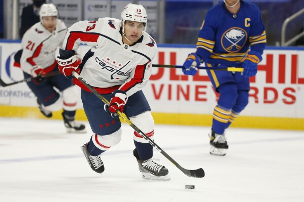 Washington Capitals forward Conor Sheary (73) carries the puck during the first period of an NHL hockey game against the Buffalo Sabres, Thursday, Jan. 14, 2021, in Buffalo, N.Y. (AP Photo/Jeffrey T. Barnes)
