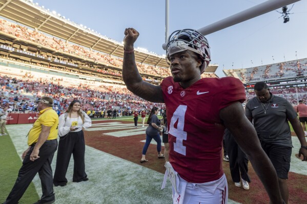 Alabama quarterback Jalen Milroe (4) lifts a fist as he celebrates a win over Mississippi after an NCAA college football game, Saturday, Sept. 23, 2023, in Tuscaloosa, Ala. (AP Photo/Vasha Hunt)