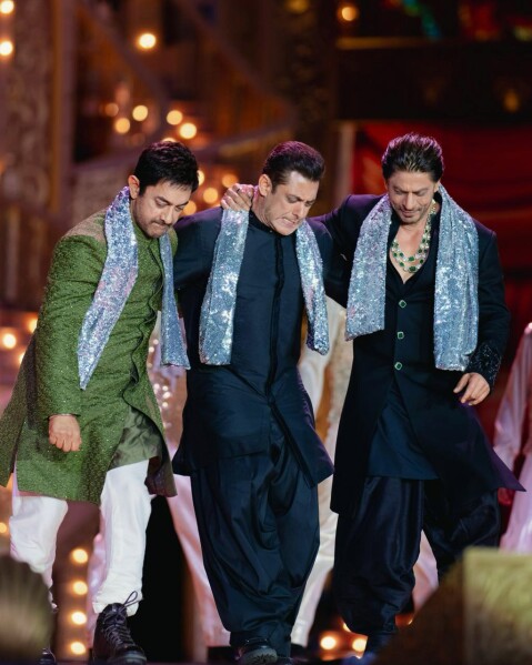 This photograph released by the Reliance group shows L to R, Bollywood stars Amir Khan, Salman Khan and Shah Rukh Khan performing at a pre-wedding bash of billionaire industrialist Mukesh Ambani's son Anant Ambani in Jamnagar, India, Saturday, Mar. 02, 2024. (Reliance group via AP)